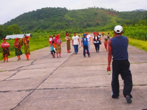 That is the airstrip we landed on. It is used as a play ground/street/hangout by the community and cleared away when a plane come in