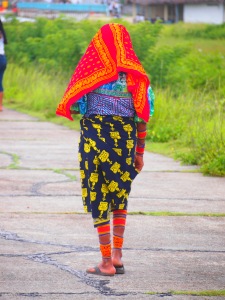 Kuna woman wearing the traditional skirt, molas and red scarf