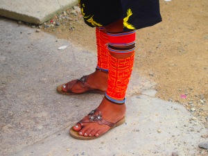 Women wear bracelets around their arms and ankles called chaquiras